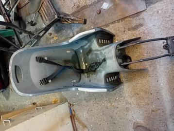 Gratis Fietszitje zonder voetensteunen.