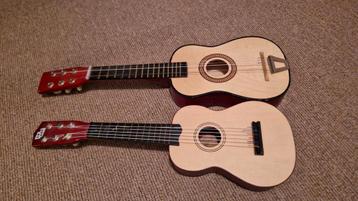 Twee speelgoed gitaren - defecte snaren