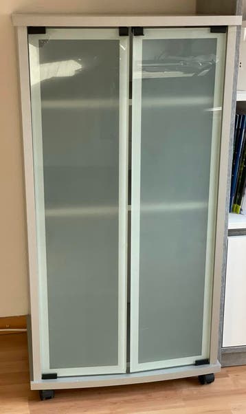 Storage cabinet with glass doors