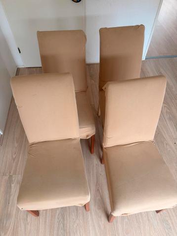 Vier beige eetkamerstoelen met stoffen bekleding