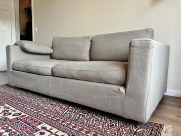 Comfortabele stoffen 2,5 zits bank met poef - gratis!