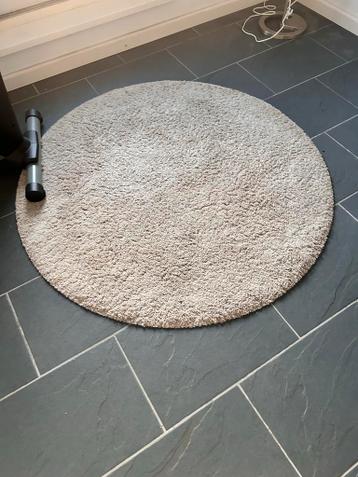 Rond beige tapijt