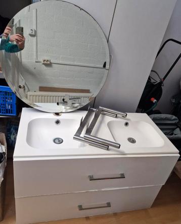 Bathroom furniture and sink with a round mirror