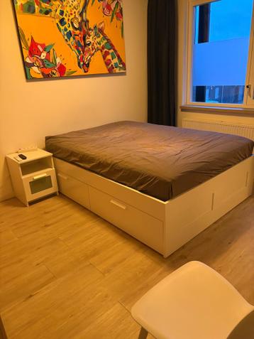 BRIMNES bedframe met opberglades wit en lattenbodem