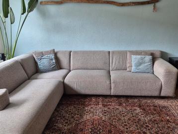 Grote montel lichtgrijze hoekbank in gemêleerde stof