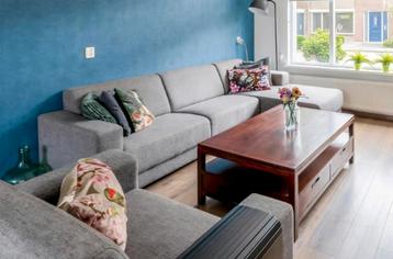 Grijze stoffen hoekbank met loveseat / stoel