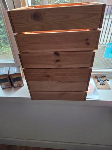 Drie kleine houten kratjes