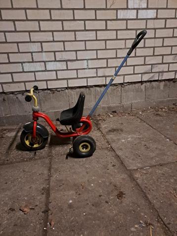 Rode driewieler met duwstang voor kinderen