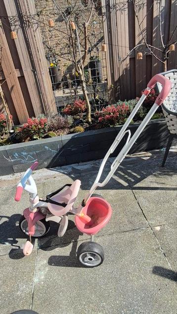 Leuk roze kinderfietsje / driewieler met duwstang