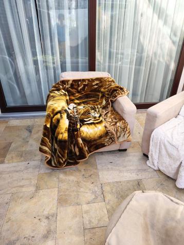 Comfortabele leren fauteuil met bijpassende poef