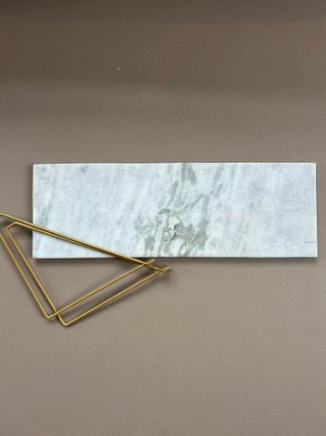 Gratis Marmeren wandplank met gouden houder