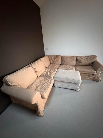 Beige/lichtbruine hoekbank met voetenbank