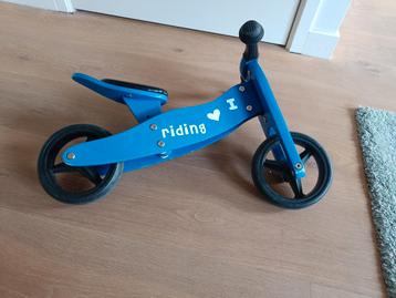 Gratis loopfiets met extra wiel voor driewieler