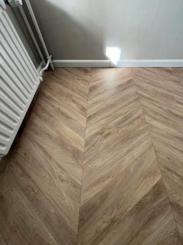 Zeil/vinyl visgraatmotief houtlook gratis 9m2