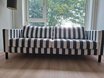 Zo goed als nieuwe gestreepte zitbank