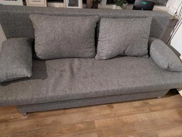 Grijze Ikea slaapbank met stoffen bekleding