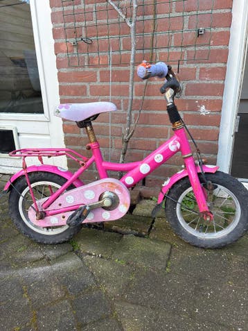 Roze kinderfiets met stippen - Gebruikt