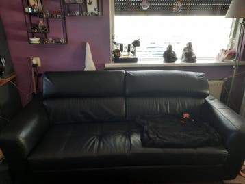 Mooie zwarte leren drie zits bank