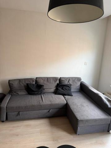 Grijze hoekbank met slaapfunctie