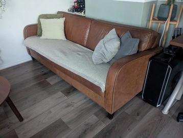 Bruin leren bank beschadigd gratis