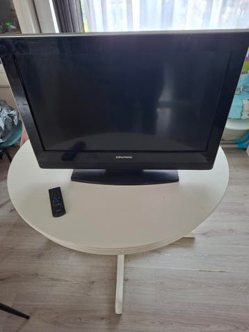 grundig tv met afstandsbediening lees beschrijving