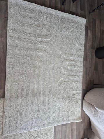 Modern wit vloerkleed met subtiel patroon