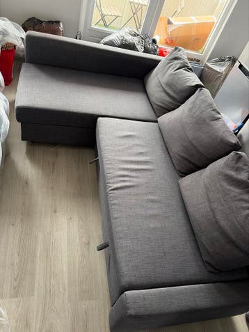 Grijze hoekbank met slaapfunctie en opbergruimte Moet nu weg