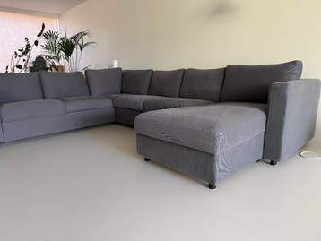 Grijze hoekbank met chaise longue (330cm x 249cm)