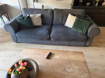 Gratis bankstel met omkeerbare kussens