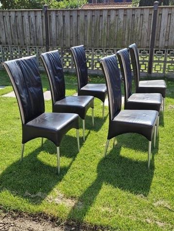 Mooie zwart lederen eetkamerstoelen