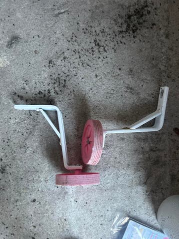 Roze zijwieltjes voor kinderfiets