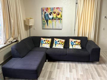 Comfortabele donkergrijze hoekbank met chaise longue