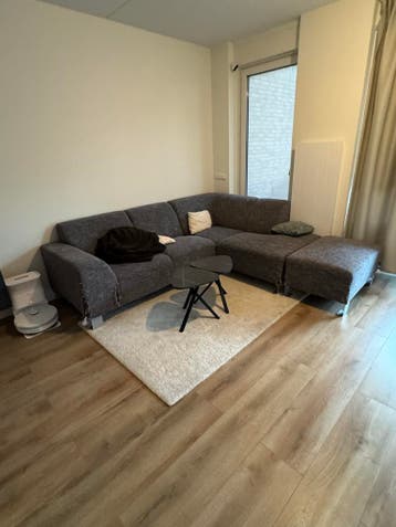 Grijze hoekbank met hocker 250 x 170 - GRATIS