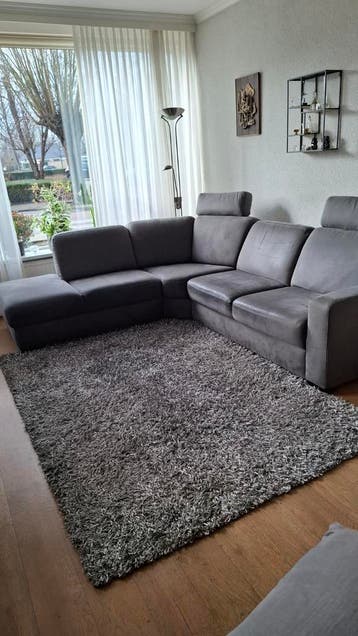 Hoekbank grijs met 2 hoofdsteunen - 2.10m x 1.90m