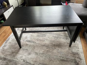 Zwarte gebruikte keukentafel met verlengstuk