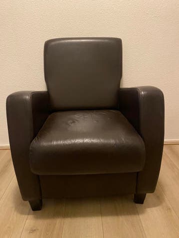 Donker bruine leren stoel/fauteuil.
