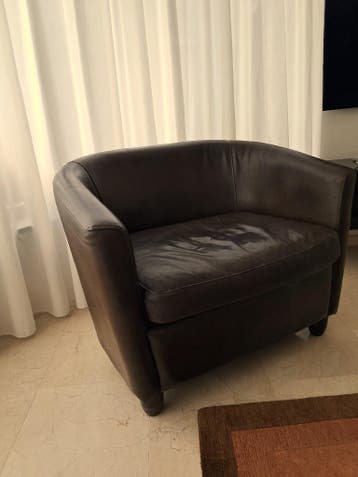 Brede leren clubfauteuil