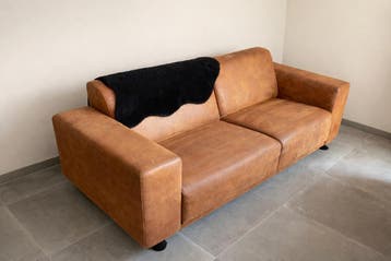 Comfortabele bank in cognac leerlook