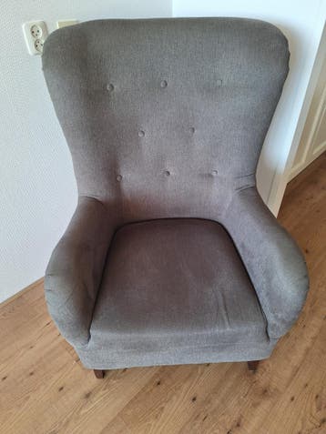 Grijze fauteuil