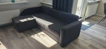 Donkergrijze hoekbank met opbergruimte
