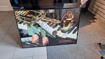 ingelijste poster met muziek afbeelding/compositie.