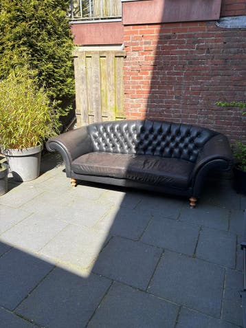 Gratis! Zwart leren bank