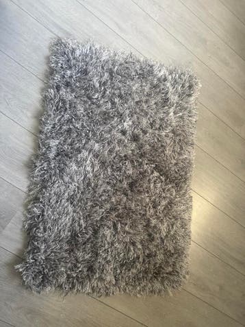 Gratis! Grijs vloerkleed