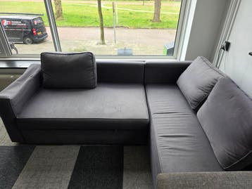 Grijze slaapbank met chaise longue