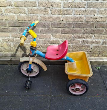 Gratis driewieler met laadbakje