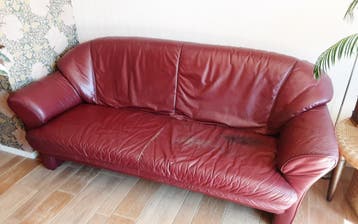 Comfortabele rode leren bank - Gebruikt