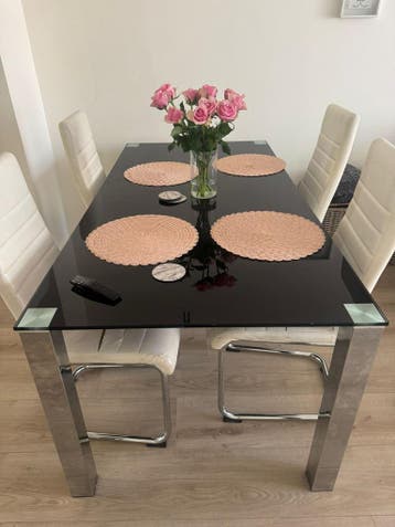 Moderne glazen eettafel / tafel met chromen onderstel