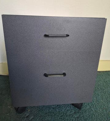 Kleine grijze ladeblok