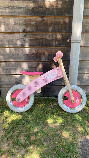 Janod roze loopfiets met rubberen 10 inch band