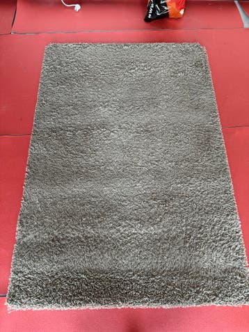 Hoogpolig taupe/grijs vloerkleed